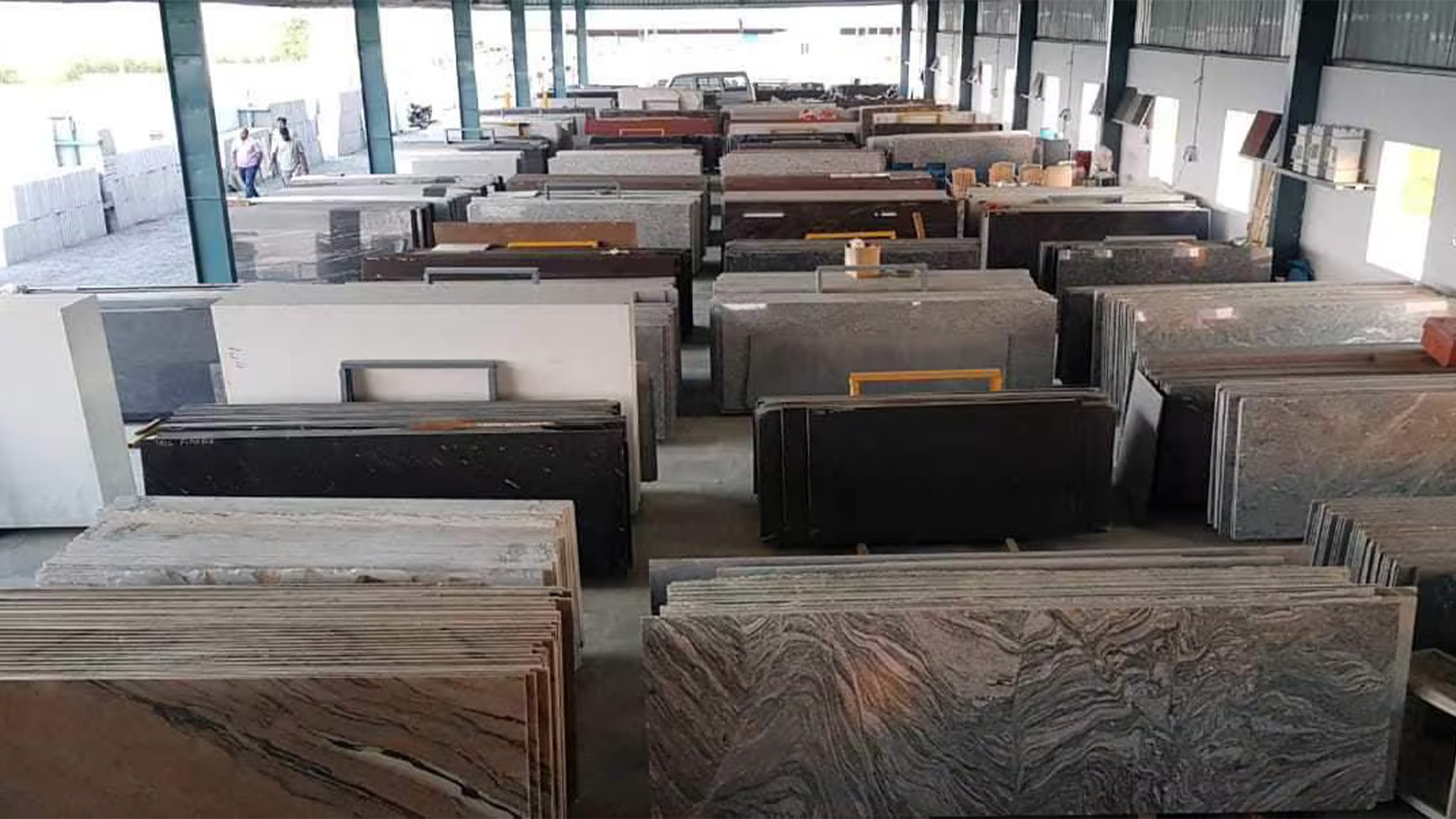 Granite slabs displayed in an Assam showroom, showing popular colours and patterns